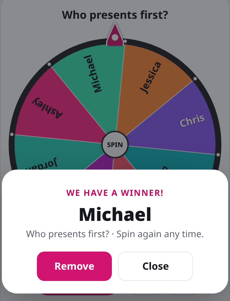 Wheel spinner winner popup over the wheel showing the picked name with Remove and Close buttons